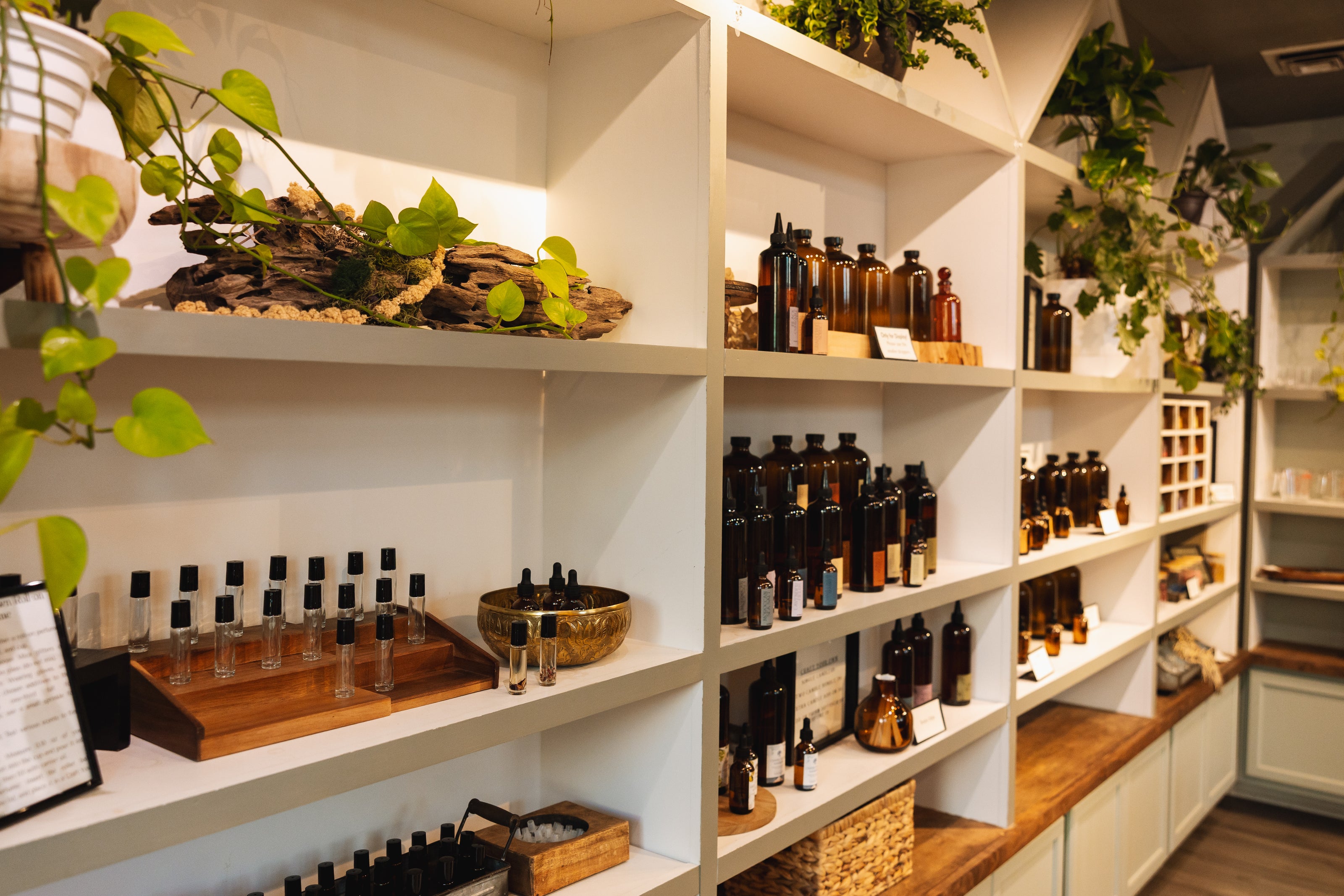 Shelves with various bottles and decorative items in a store setting